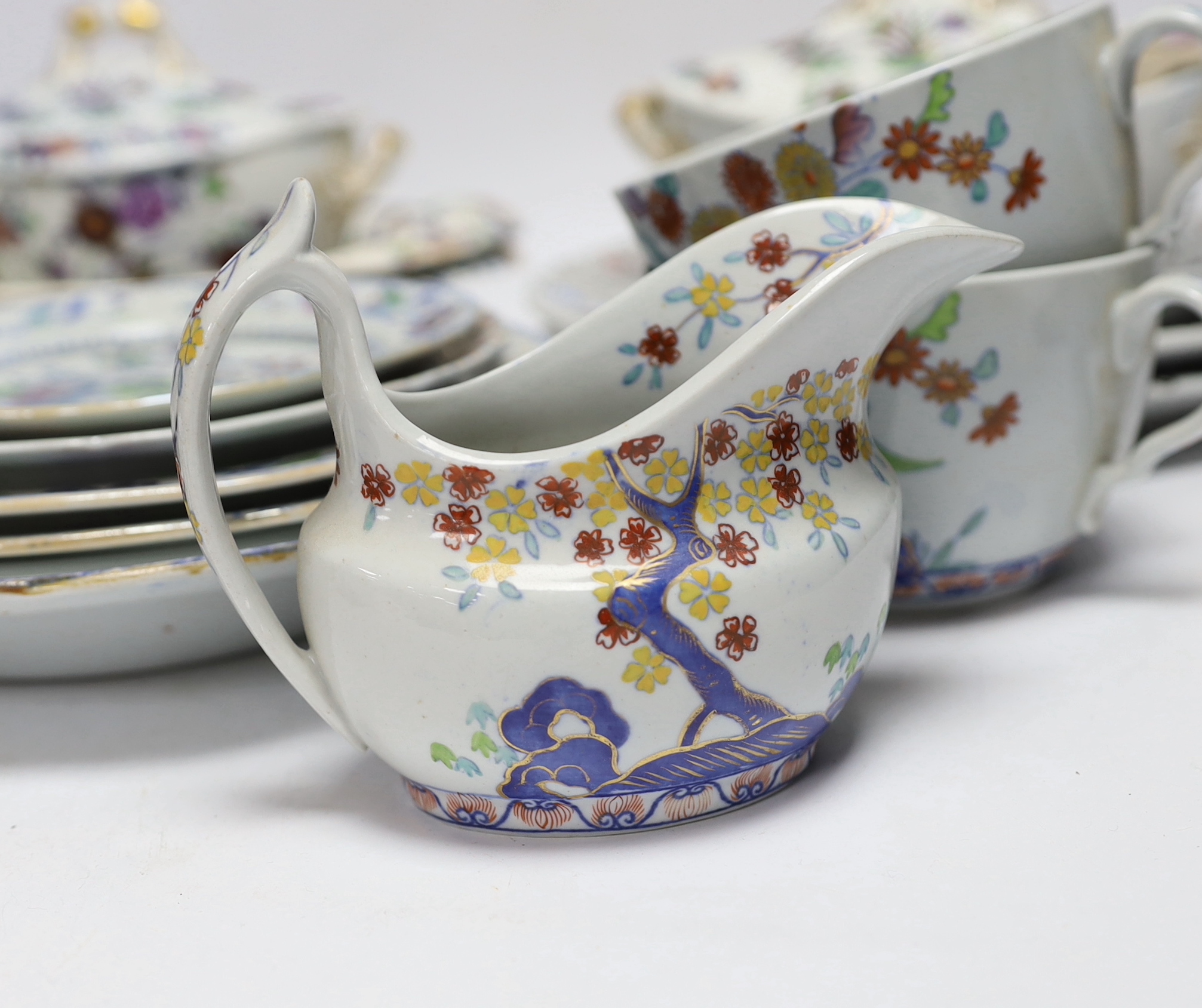 A collection of Spode Ironstone and pottery blue tea and dinnerware, including a pair of oval boat shaped sauce tureens and covers and a pair of shell shaped dessert dishes